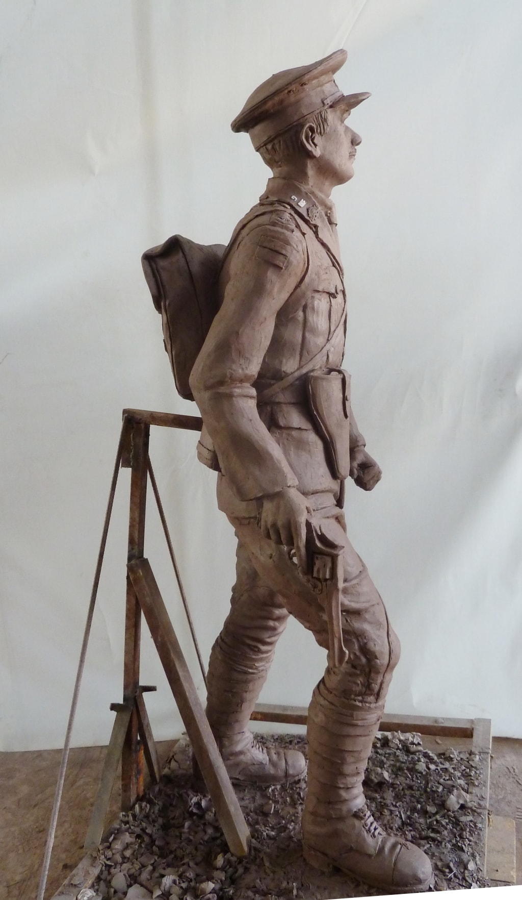 Side view of the clay mould for a bronze memorial statue