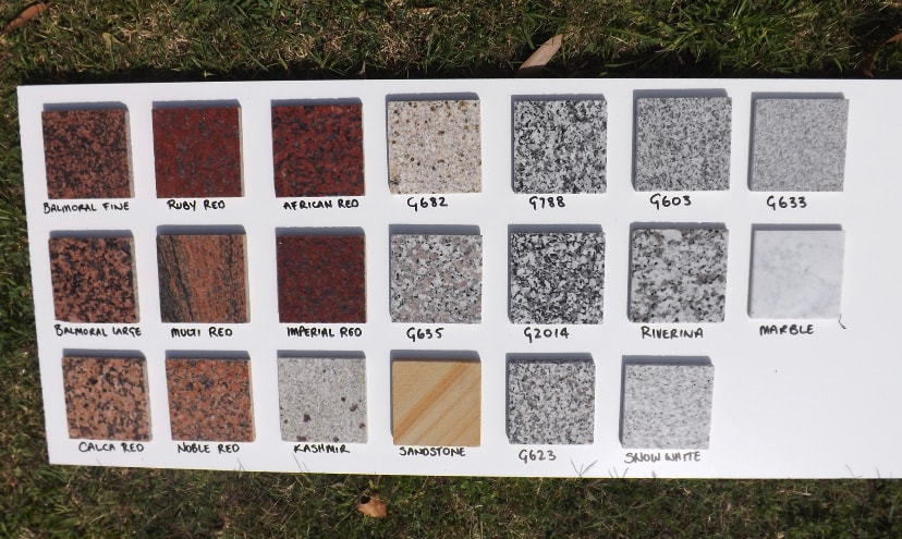 Granite colour board featuring red, cream, white and sandstone finishes