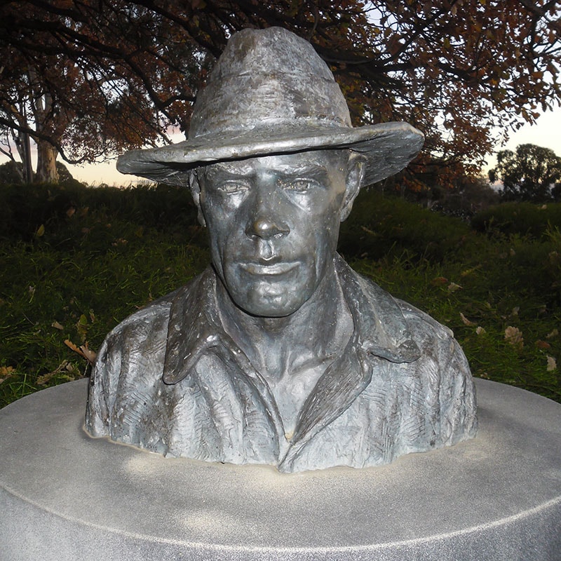 Bronze bust sculpture with hat