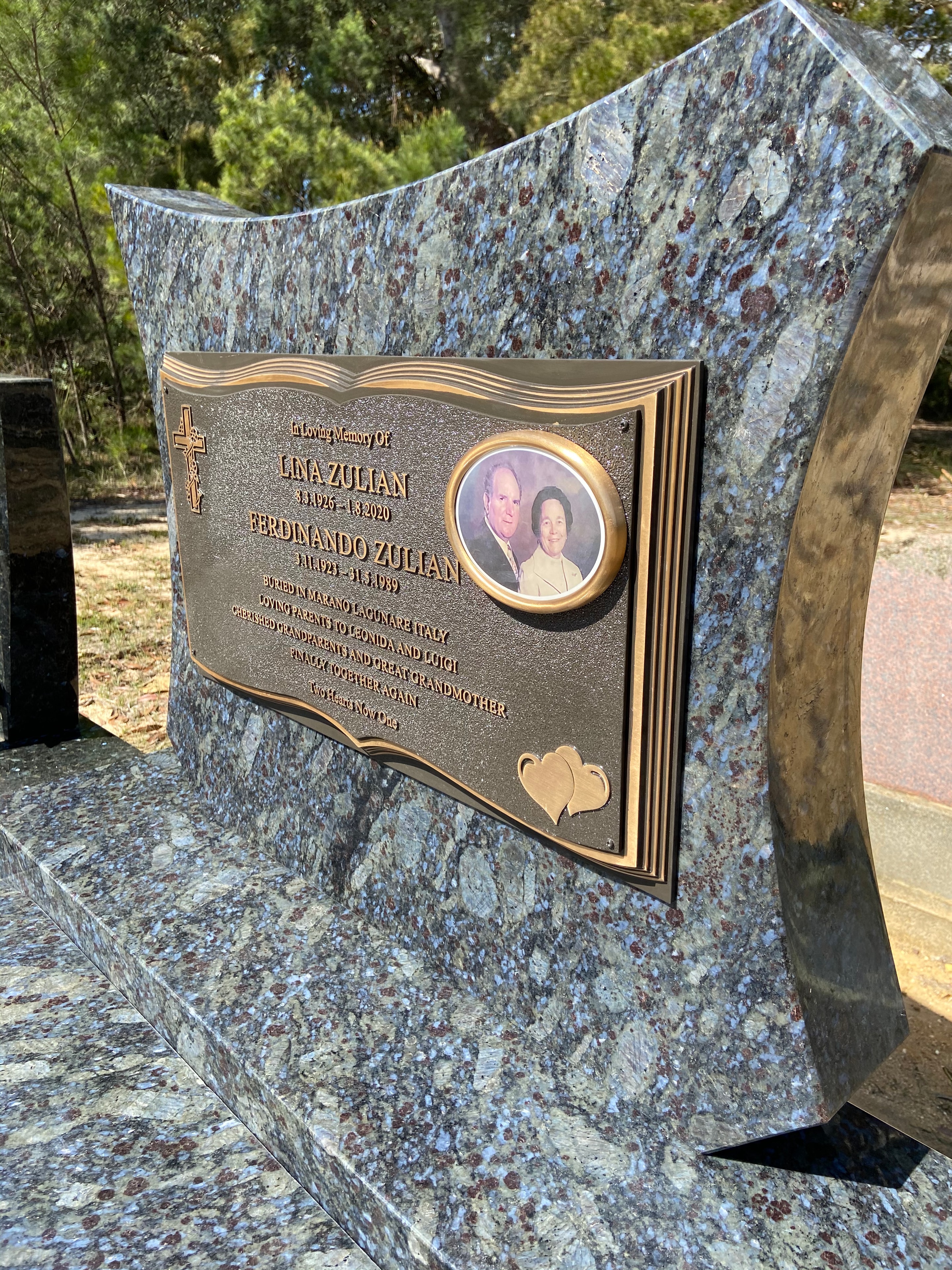 Lana and Ferdinando Zulian bronze plaque on curved granite monument