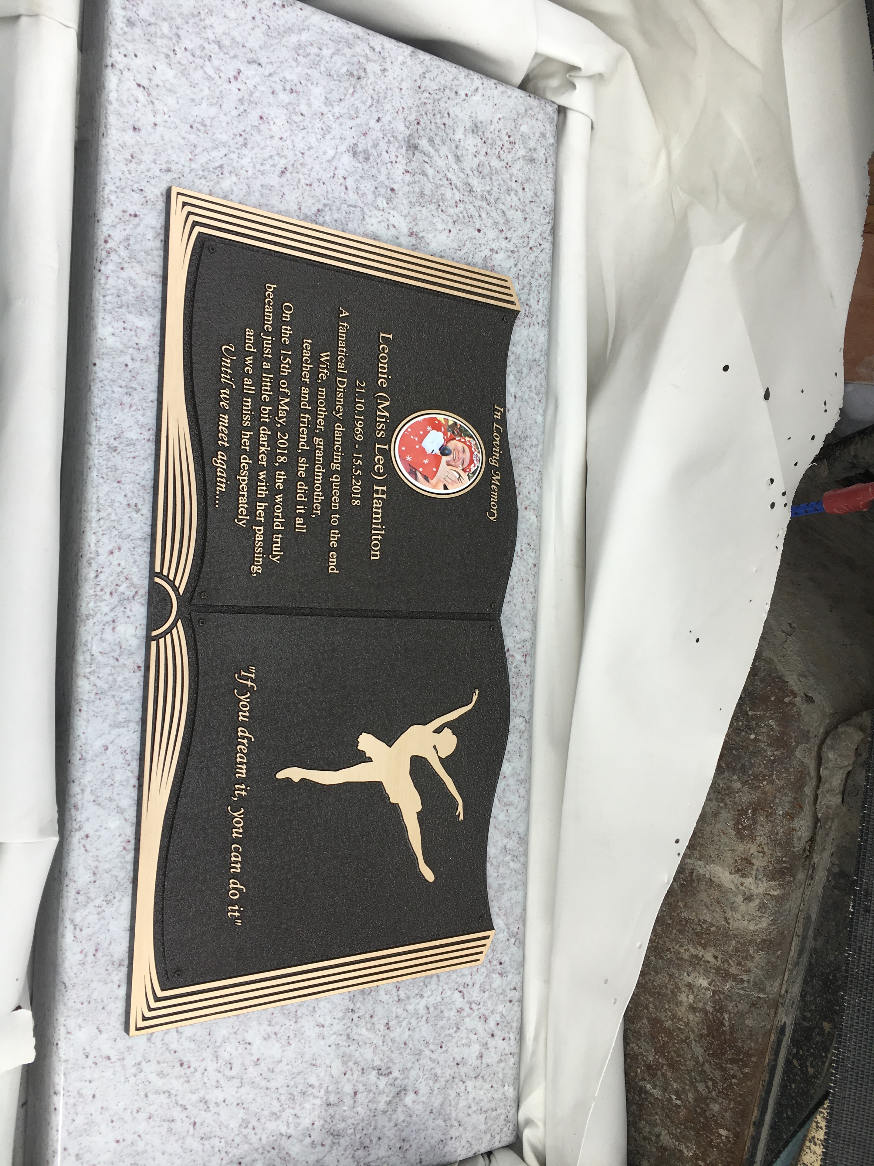Leonie Hamilton book-style memorial plaque with portrait and dancer motif