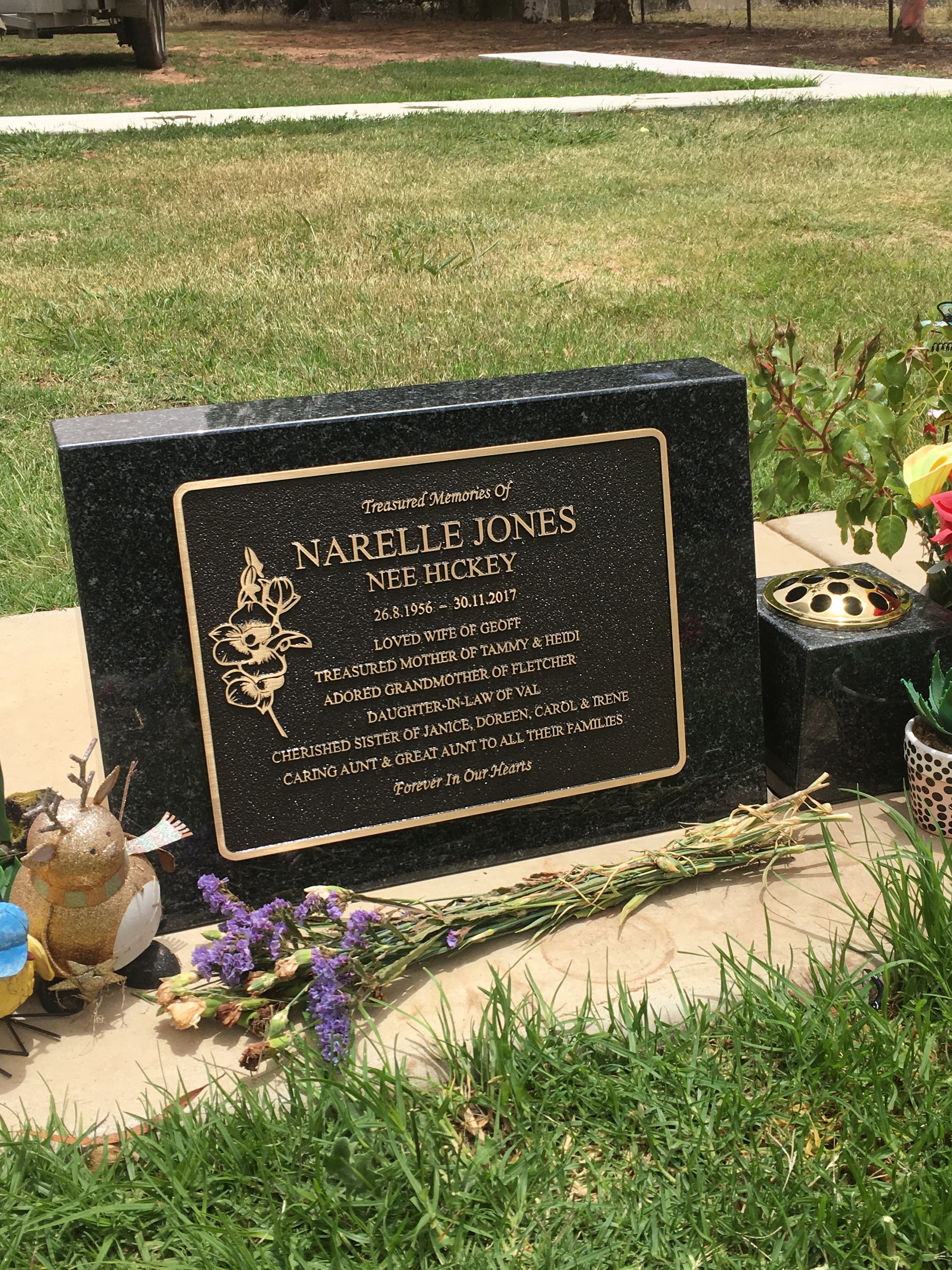 Narelle Jones memorial plaque in a garden setting