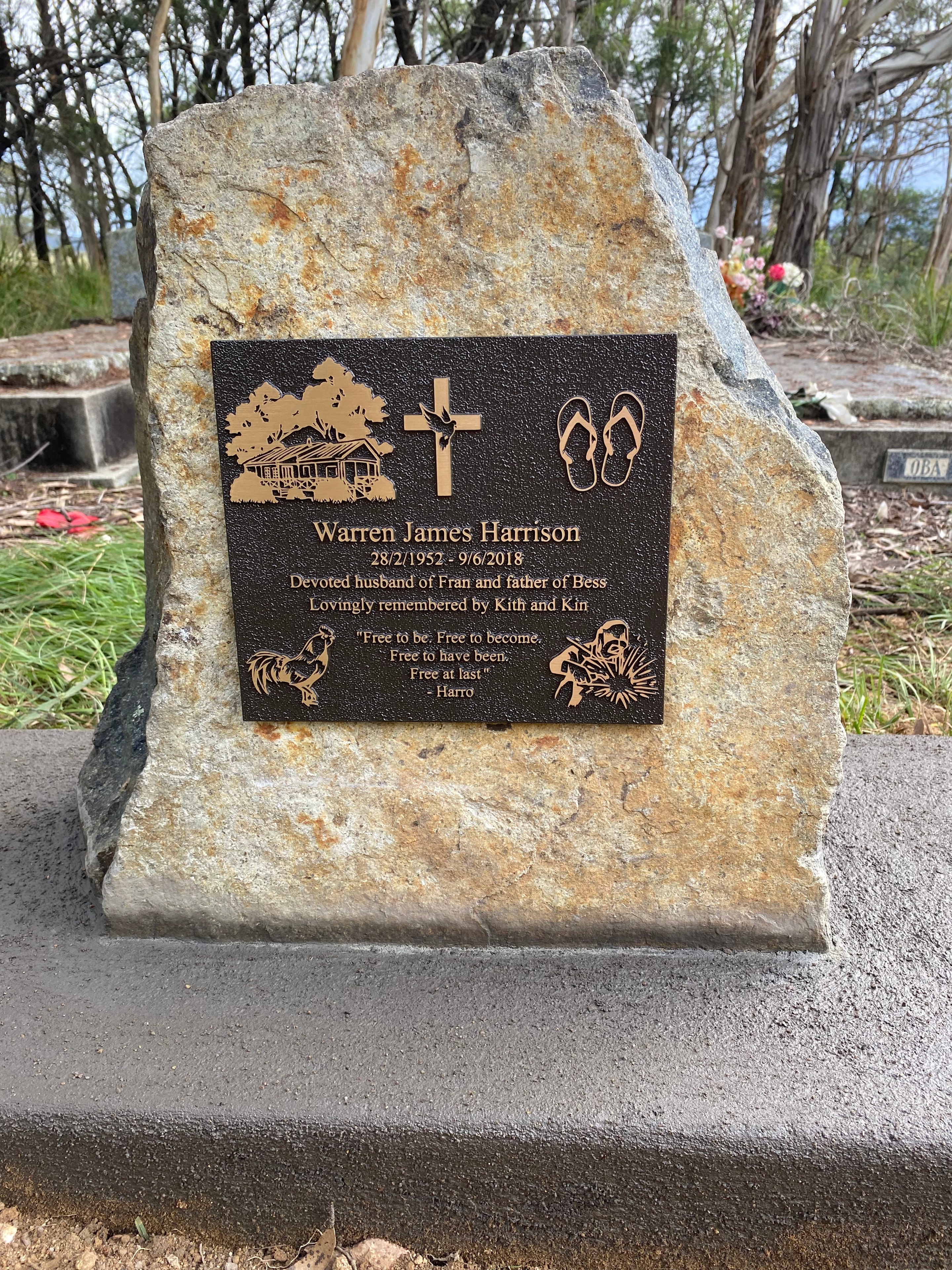 Warren James Harrison bronze plaque mounted on natural stone memorial